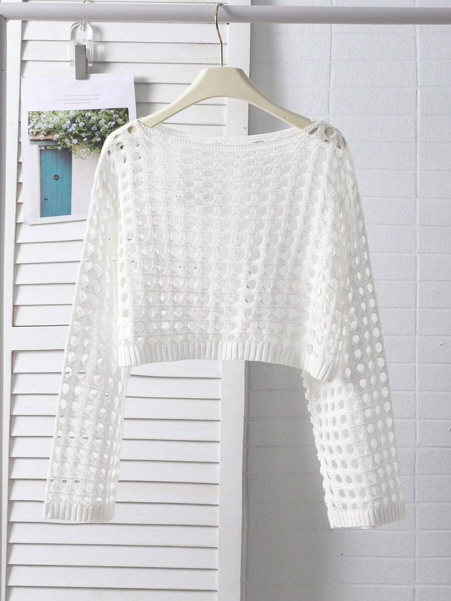 White tween girls beach cover up with cut out details, boat neckline, long bell sleeves, regular length knitwear design, and medium stretch viscose fabric.