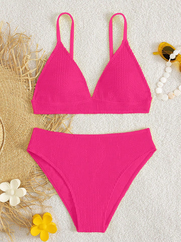 Tween girls two-piece bikini swimwear set with a solid color textured design, spaghetti strap top, wireless bra, and mid-waist lined bikini bottoms.