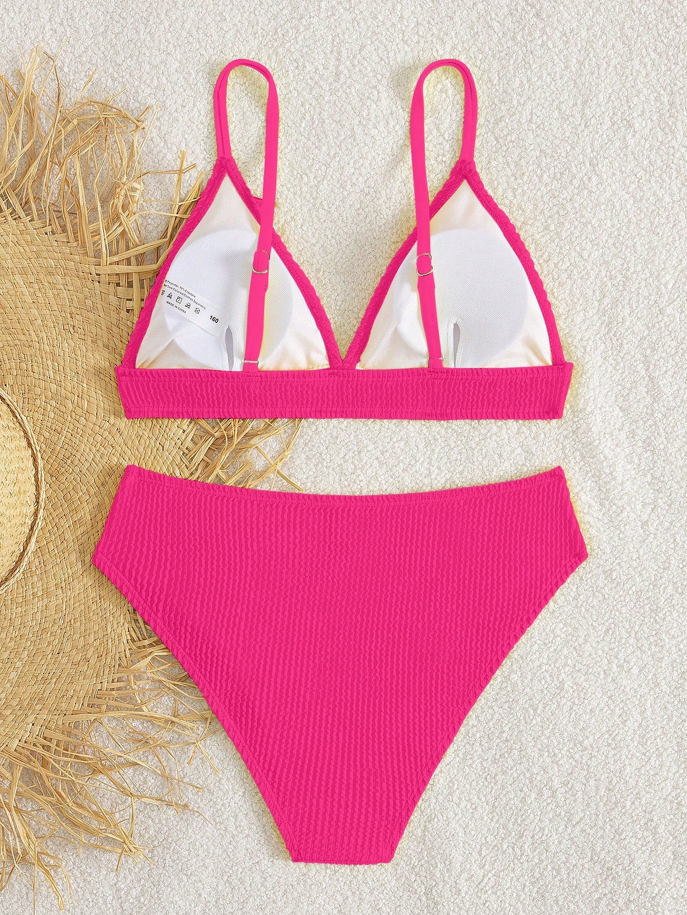 Tween girls two-piece bikini swimwear set with a solid color textured design, spaghetti strap top, wireless bra, and mid-waist lined bikini bottoms.