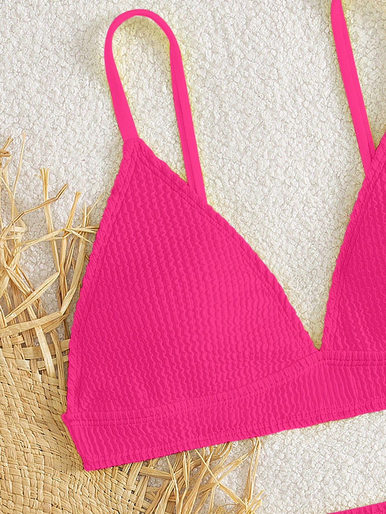 Tween girls two-piece bikini swimwear set with a solid color textured design, spaghetti strap top, wireless bra, and mid-waist lined bikini bottoms.