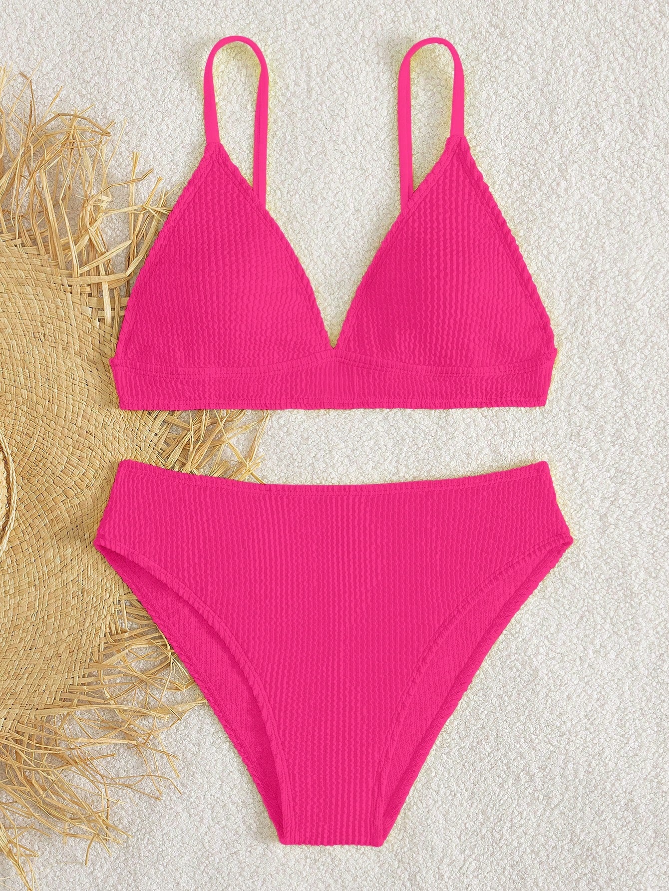 Tween girls two-piece bikini swimwear set with a solid color textured design, spaghetti strap top, wireless bra, and mid-waist lined bikini bottoms.