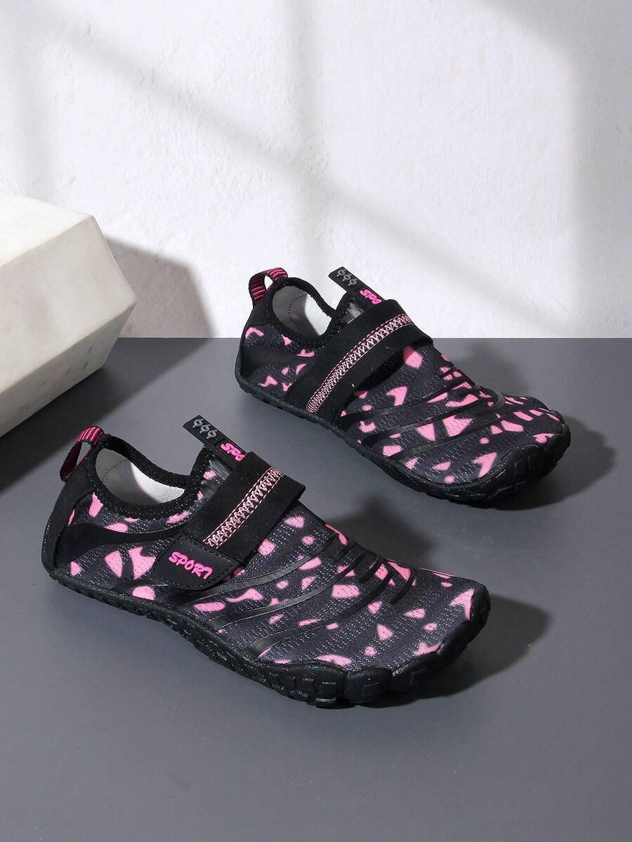Boys green floral pattern lightweight mesh water shoes with non-slip rubber outsole and hook loop closure.