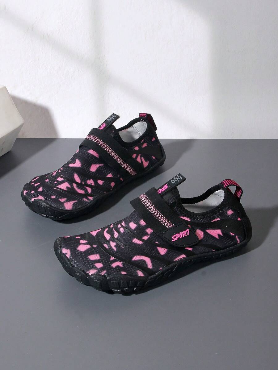 Boys green floral pattern lightweight mesh water shoes with non-slip rubber outsole and hook loop closure.