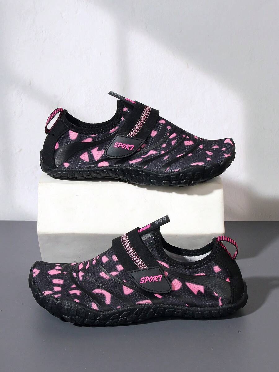 Boys green floral pattern lightweight mesh water shoes with non-slip rubber outsole and hook loop closure.