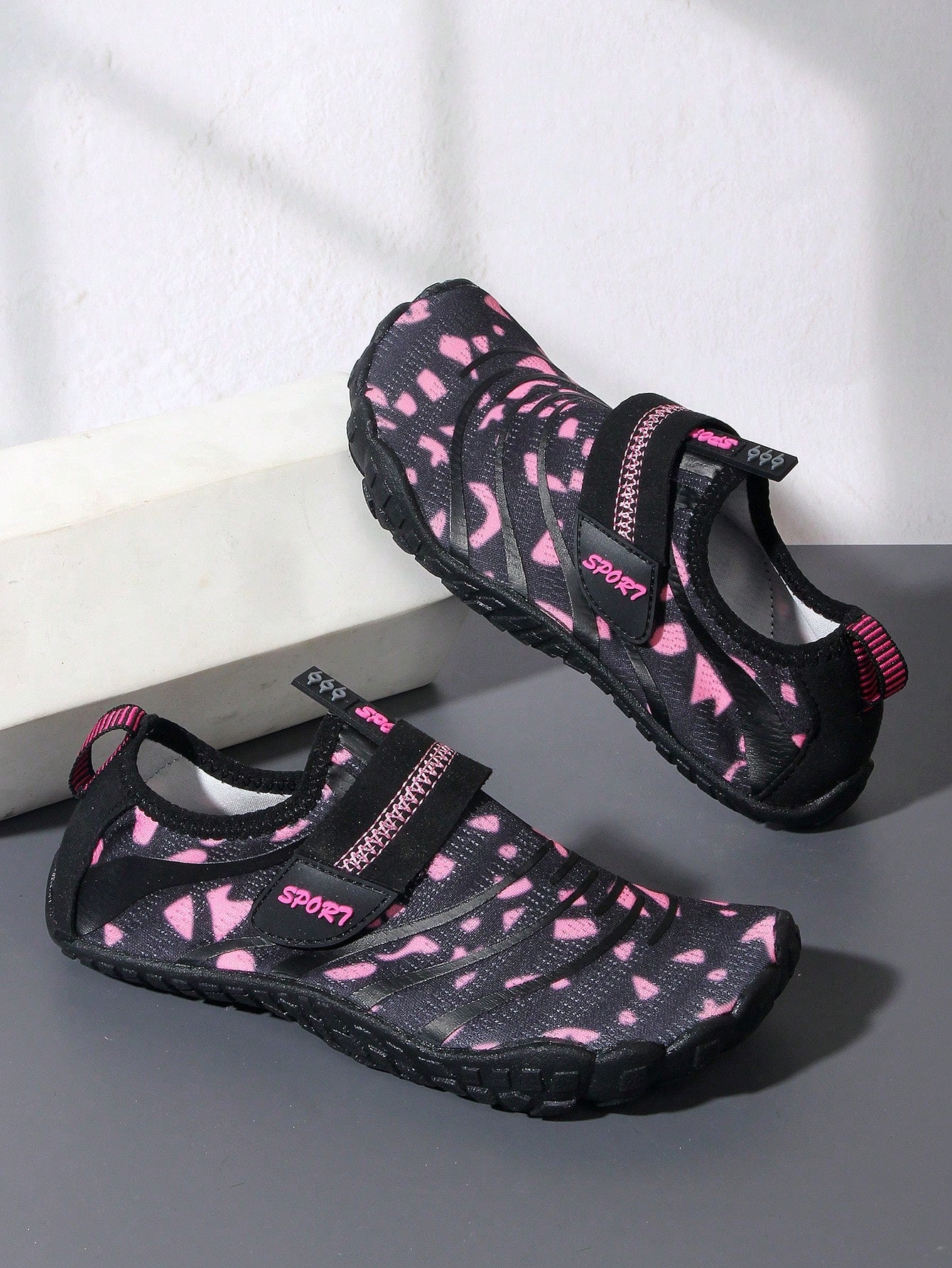 Boys green floral pattern lightweight mesh water shoes with non-slip rubber outsole and hook loop closure.