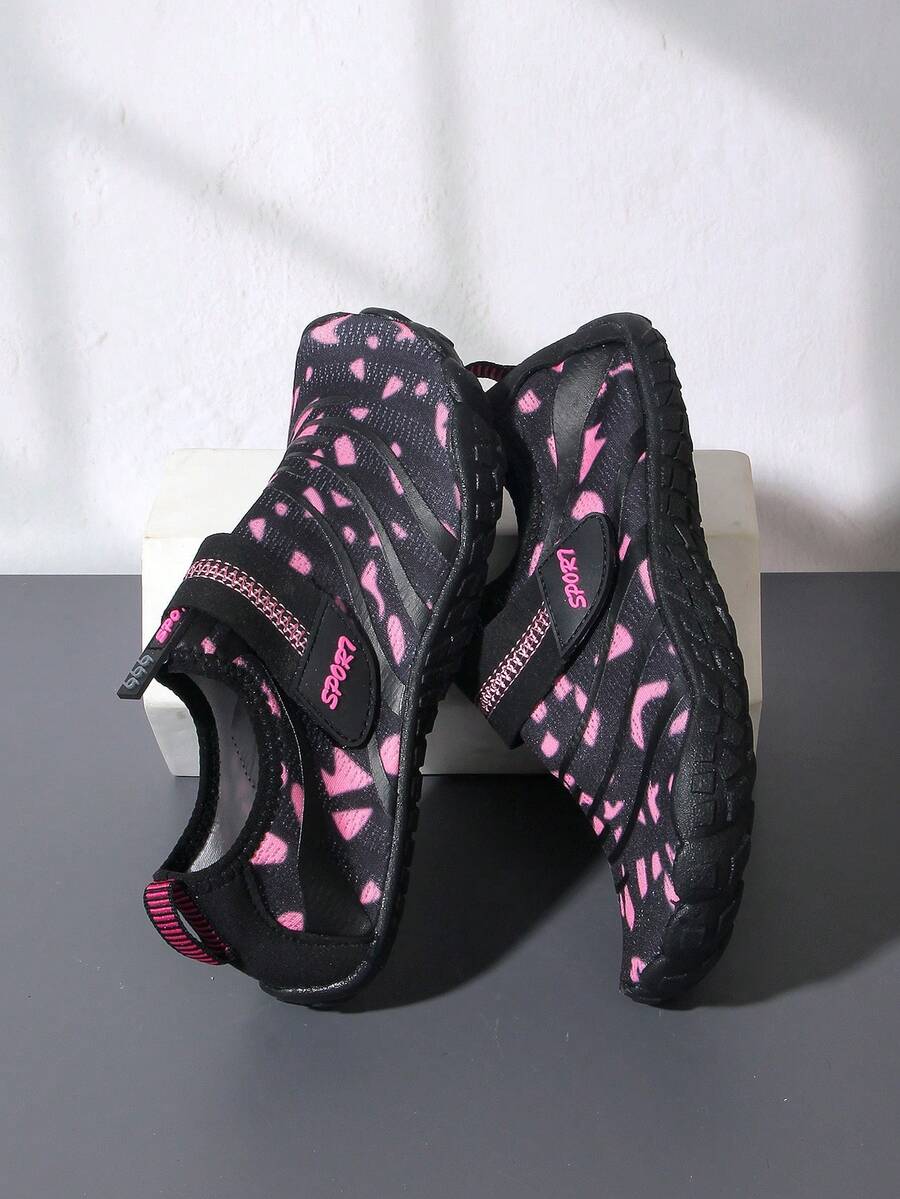 Boys green floral pattern lightweight mesh water shoes with non-slip rubber outsole and hook loop closure.