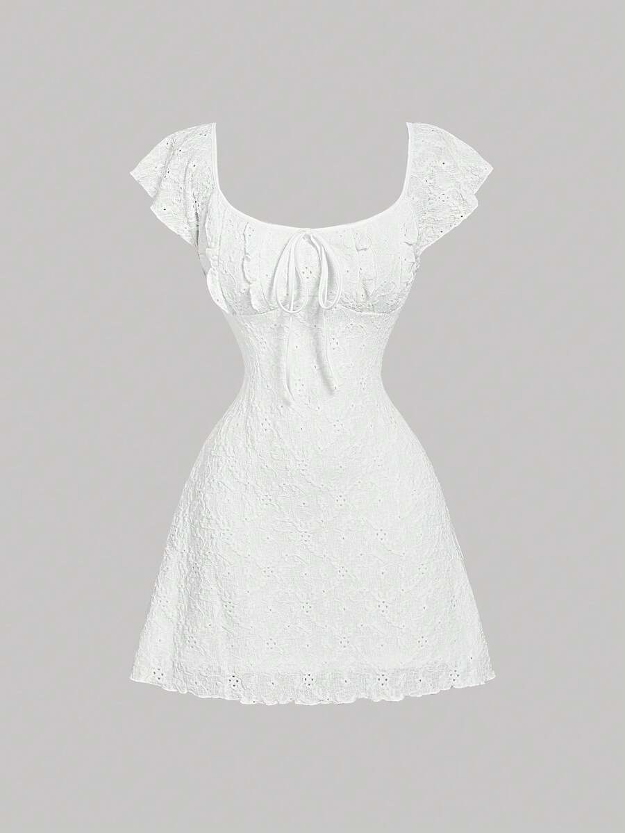 White eyelet lace A-line mini dress for tween girls with short puff sleeves, sweetheart neckline, high waist, and flared hem