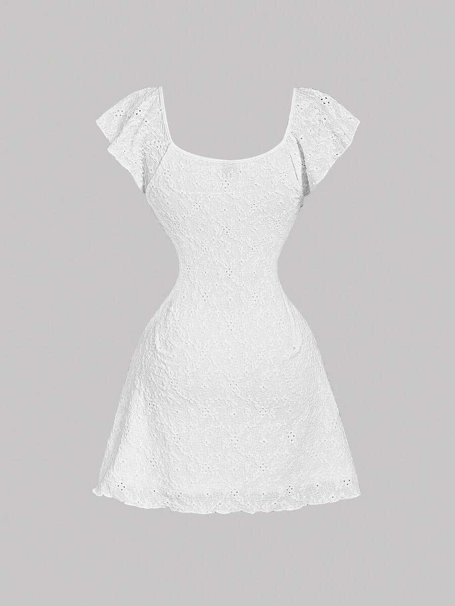 White eyelet lace A-line mini dress for tween girls with short puff sleeves, sweetheart neckline, high waist, and flared hem