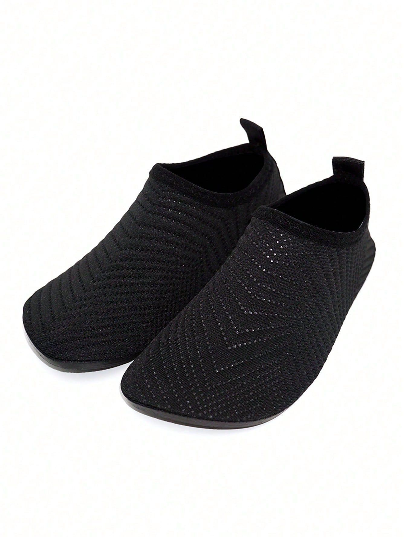 Black breathable slip-on aqua socks for boys featuring polyester material and TPR outsole.