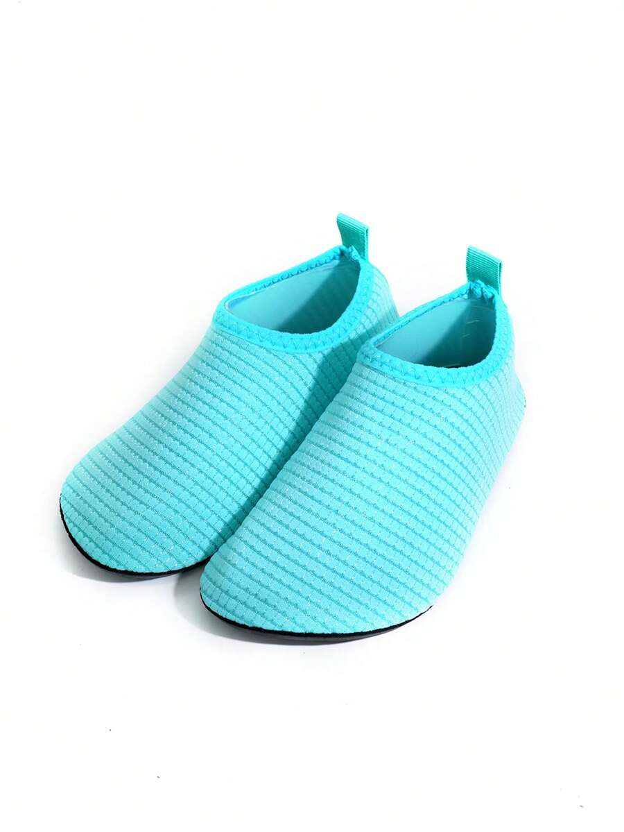 Boys breathable slip-on aqua water shoes featuring contrast binding and non-slip TPR soles for beach and outdoor activities.