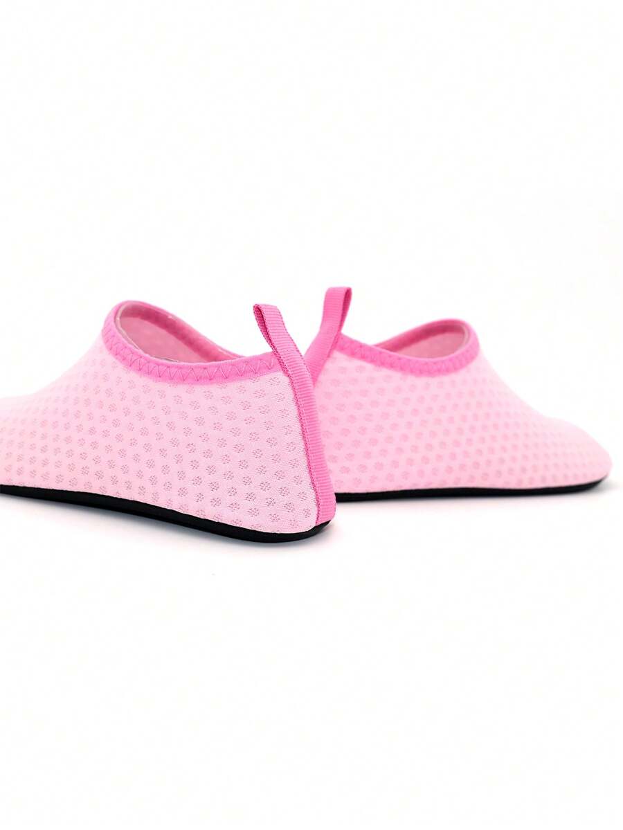 Boys breathable slip-on aqua water shoes featuring contrast binding and non-slip TPR soles for beach and outdoor activities.