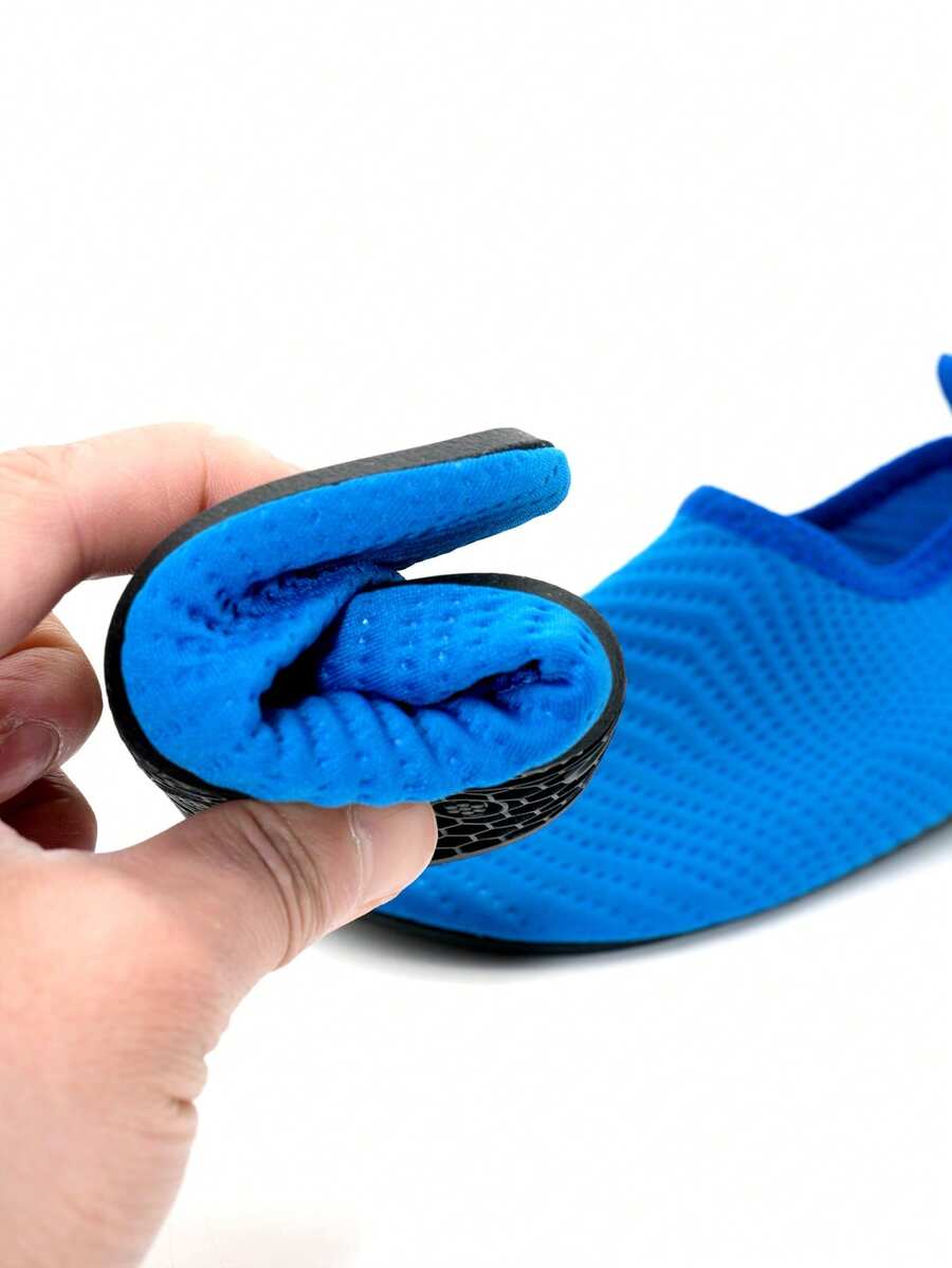 Boys breathable slip-on aqua water shoes featuring contrast binding and non-slip TPR soles for beach and outdoor activities.