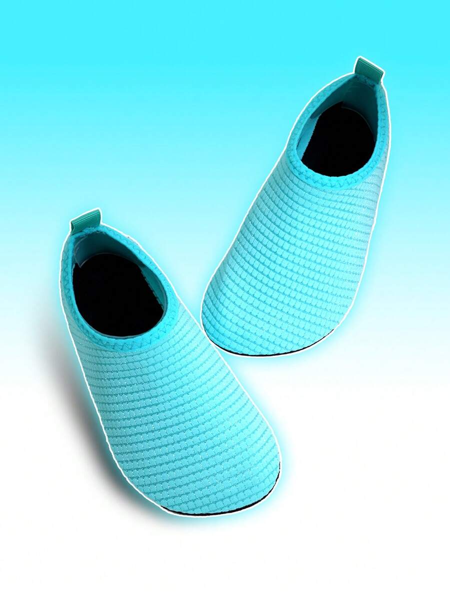 Boys breathable slip-on aqua water shoes featuring contrast binding and non-slip TPR soles for beach and outdoor activities.
