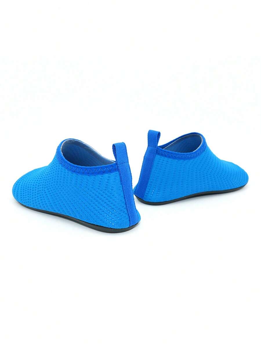 Boys breathable slip-on aqua water shoes featuring contrast binding and non-slip TPR soles for beach and outdoor activities.