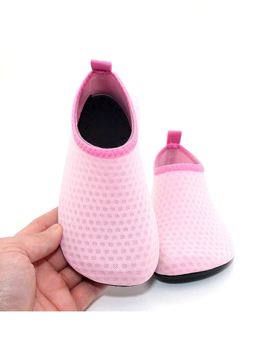 Boys breathable slip-on aqua water shoes featuring contrast binding and non-slip TPR soles for beach and outdoor activities.