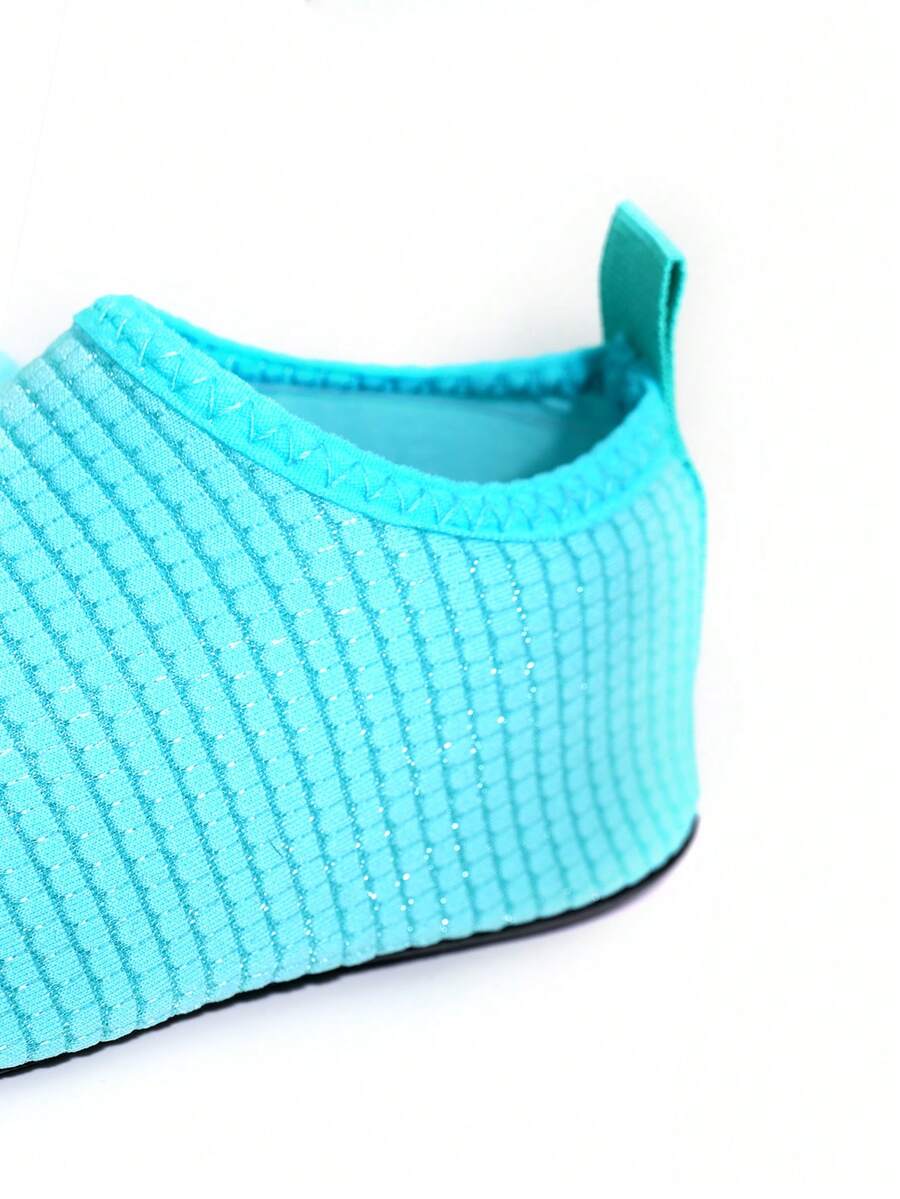 Boys breathable slip-on aqua water shoes featuring contrast binding and non-slip TPR soles for beach and outdoor activities.