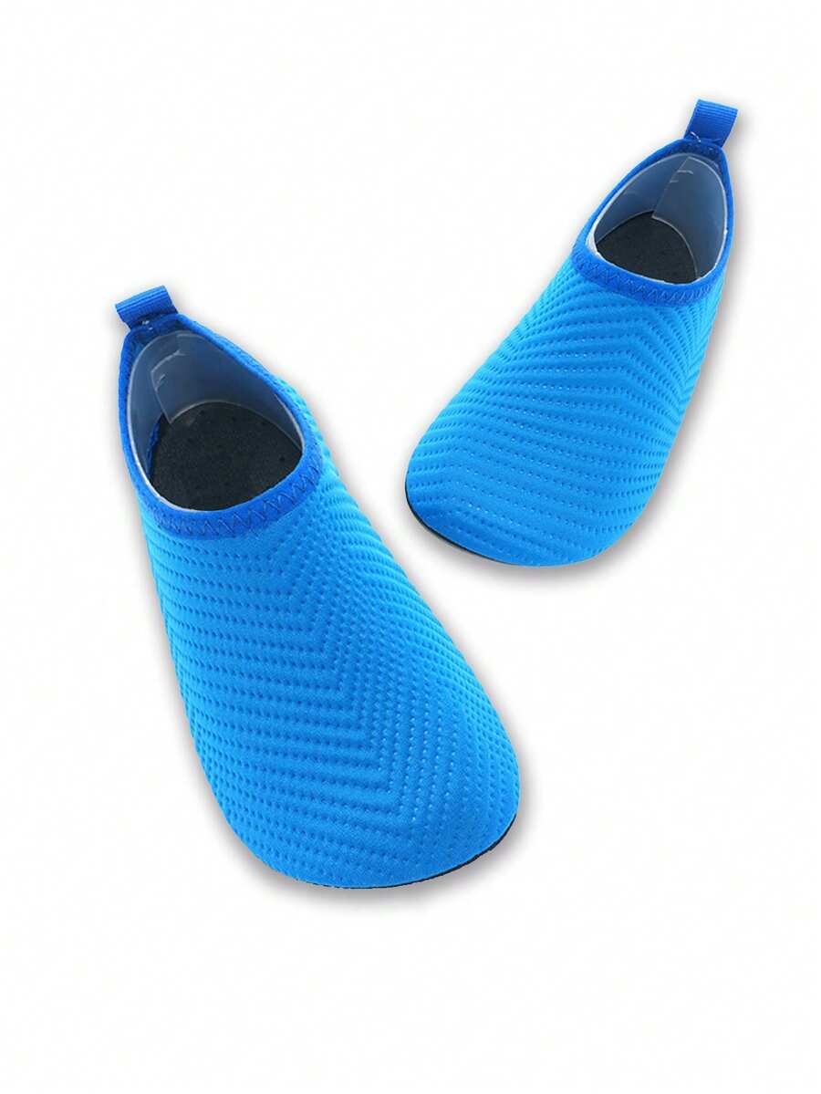 Boys breathable slip-on aqua water shoes featuring contrast binding and non-slip TPR soles for beach and outdoor activities.