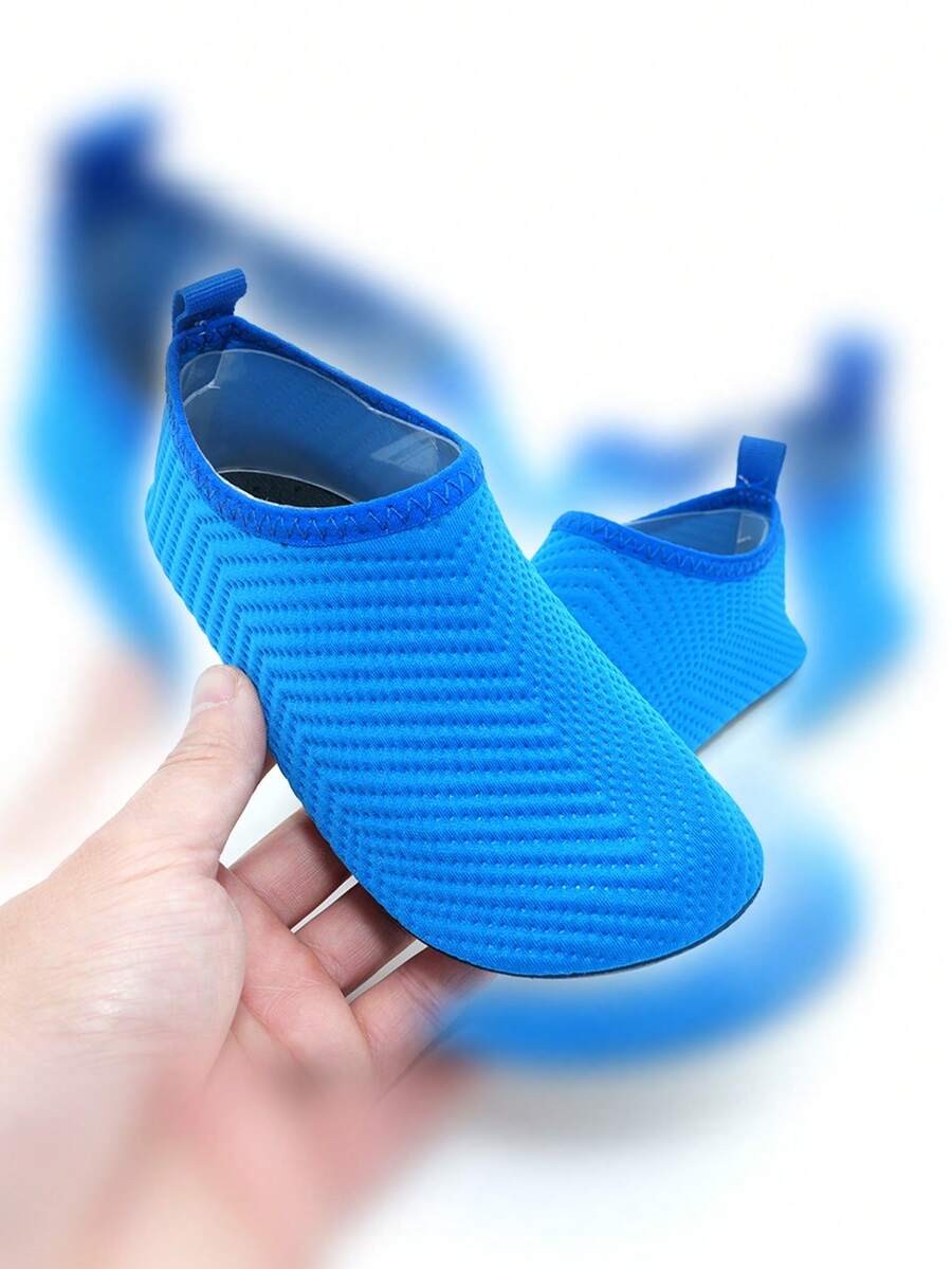 Boys breathable slip-on aqua water shoes featuring contrast binding and non-slip TPR soles for beach and outdoor activities.