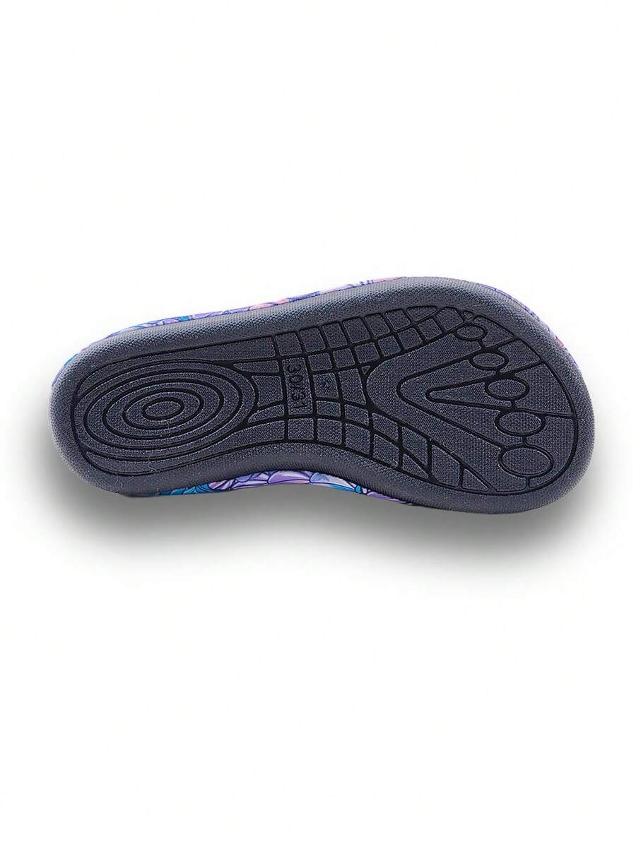 Blue kids water shoes with a shark print pattern, breathable fabric upper, and secure hook and loop closure.