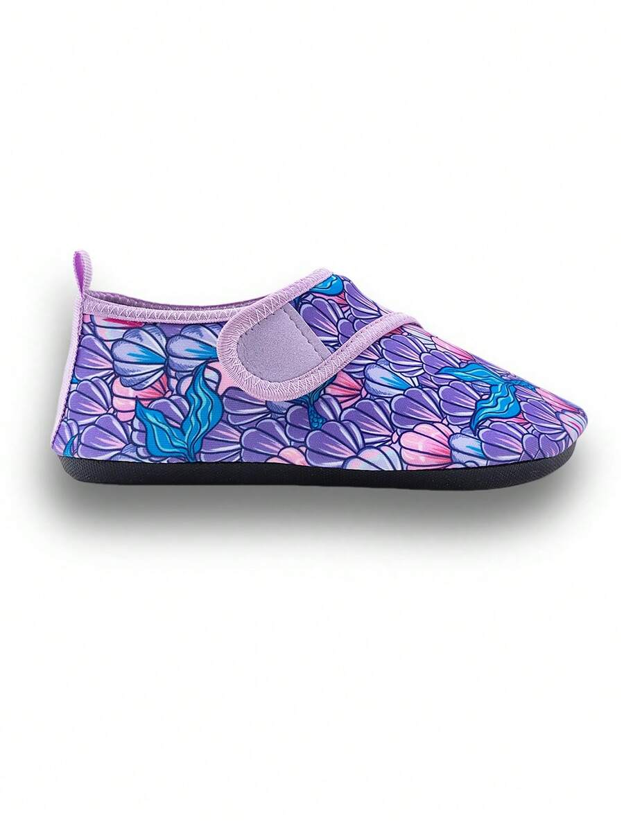 Blue kids water shoes with a shark print pattern, breathable fabric upper, and secure hook and loop closure.