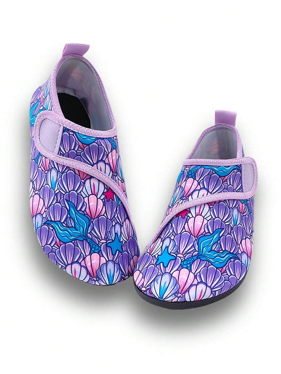Blue kids water shoes with a shark print pattern, breathable fabric upper, and secure hook and loop closure.