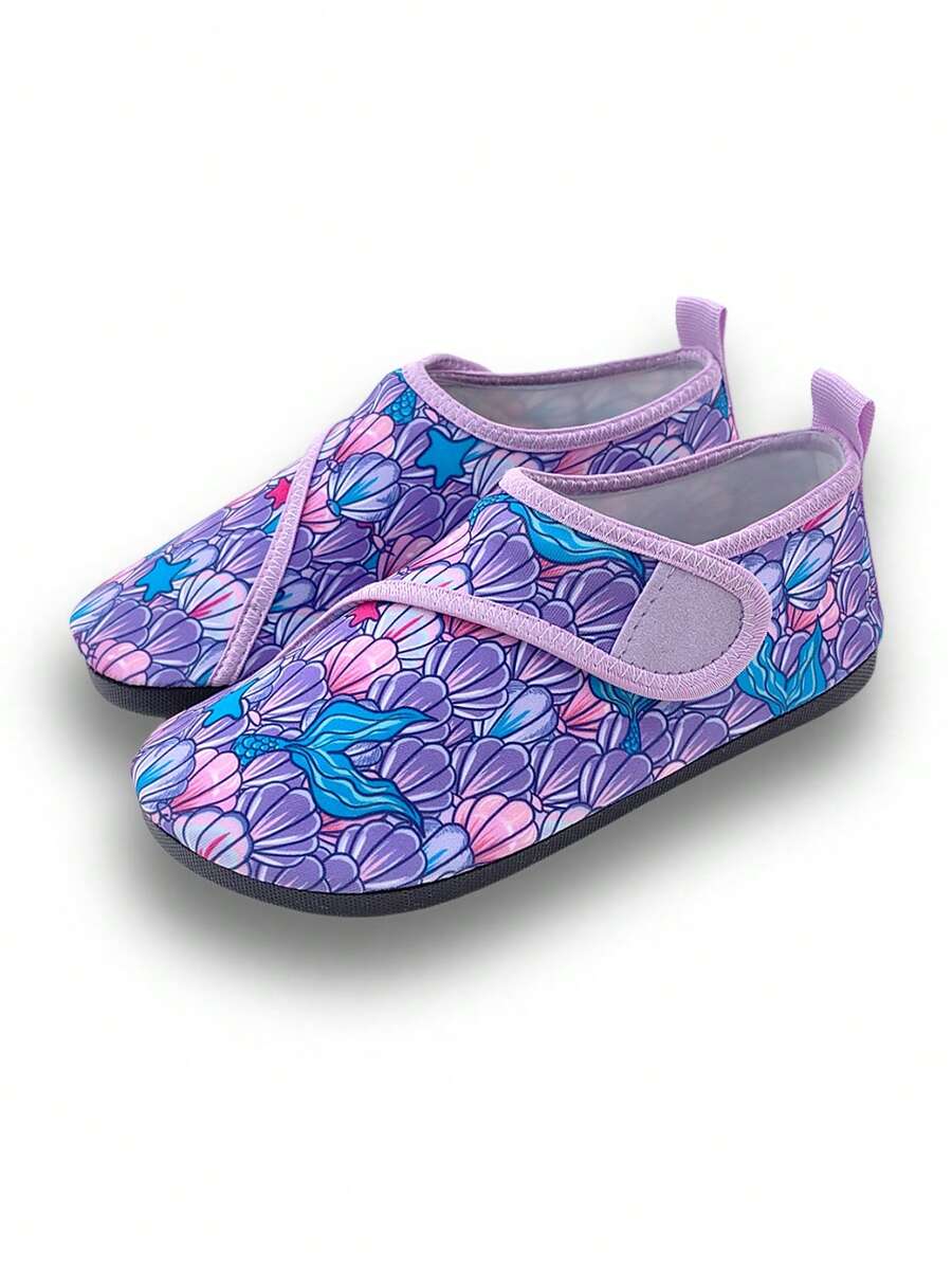 Blue kids water shoes with a shark print pattern, breathable fabric upper, and secure hook and loop closure.