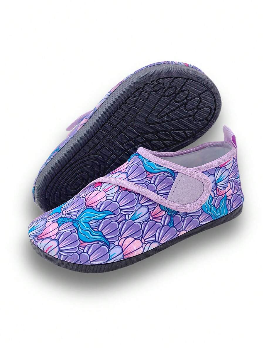Blue kids water shoes with a shark print pattern, breathable fabric upper, and secure hook and loop closure.