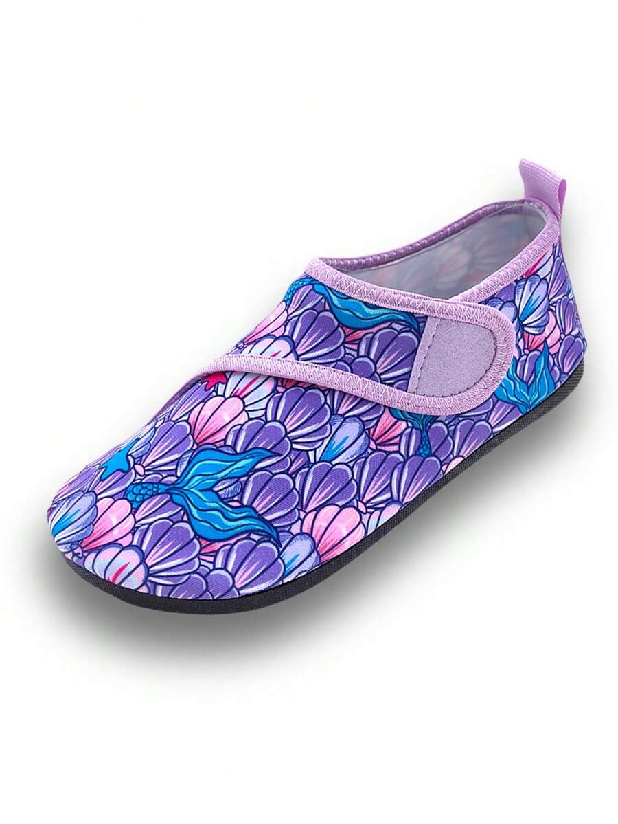 Blue kids water shoes with a shark print pattern, breathable fabric upper, and secure hook and loop closure.