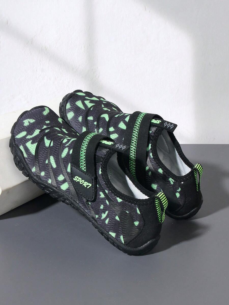 Boys green floral pattern lightweight mesh water shoes with non-slip rubber outsole and hook loop closure.