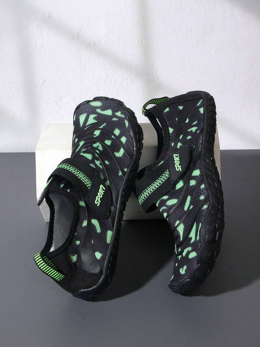 Boys green floral pattern lightweight mesh water shoes with non-slip rubber outsole and hook loop closure.