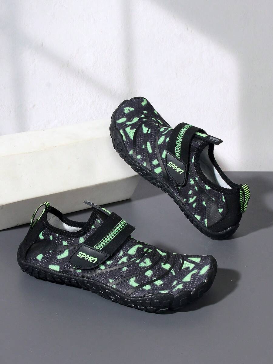 Boys green floral pattern lightweight mesh water shoes with non-slip rubber outsole and hook loop closure.