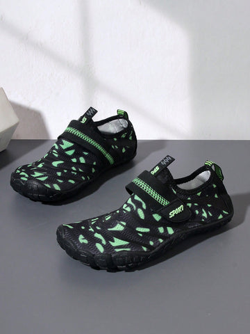 Boys green floral pattern lightweight mesh water shoes with non-slip rubber outsole and hook loop closure.