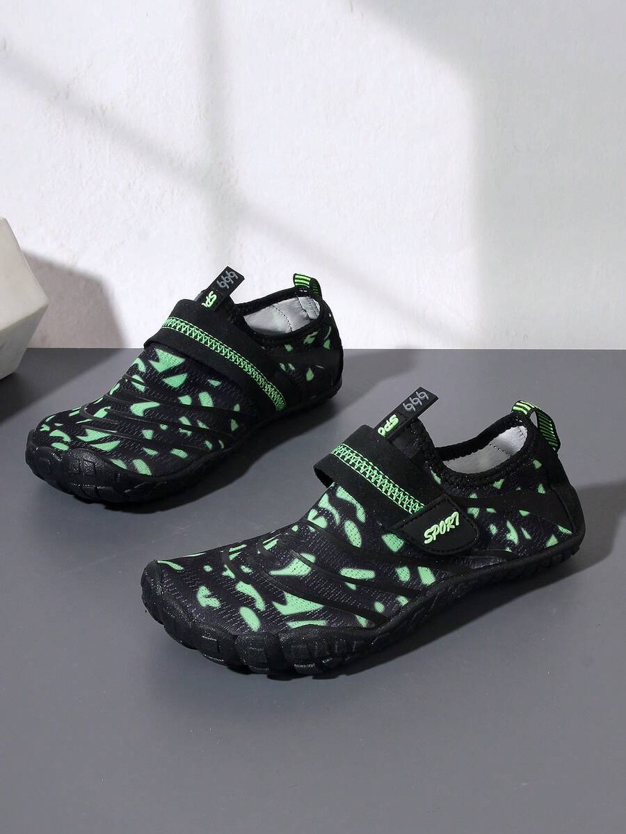 Boys green floral pattern lightweight mesh water shoes with non-slip rubber outsole and hook loop closure.
