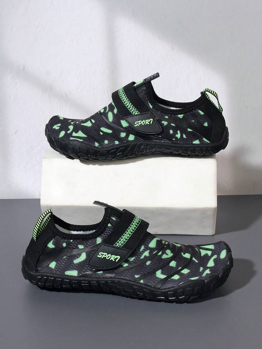 Boys green floral pattern lightweight mesh water shoes with non-slip rubber outsole and hook loop closure.