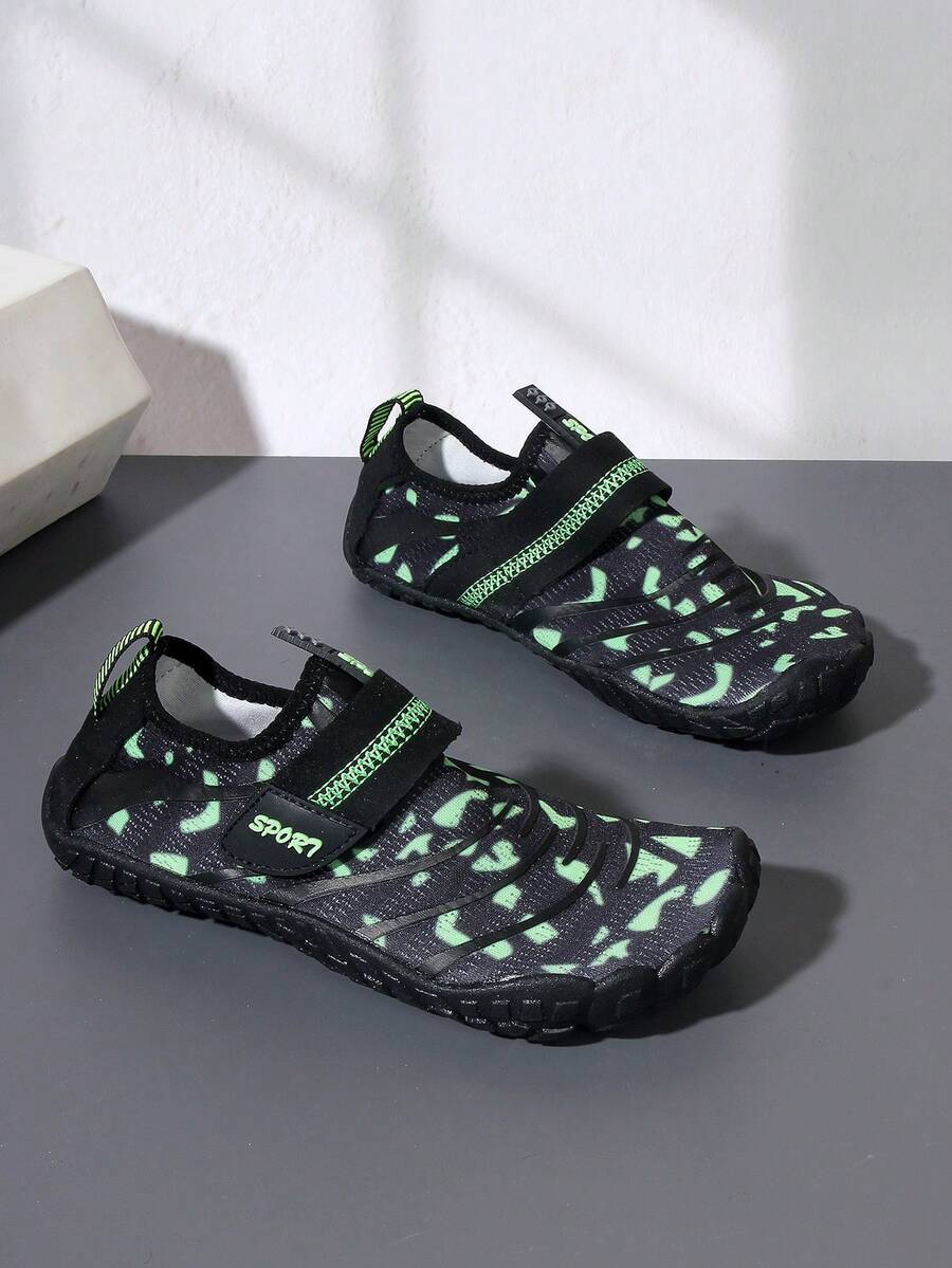 Boys green floral pattern lightweight mesh water shoes with non-slip rubber outsole and hook loop closure.