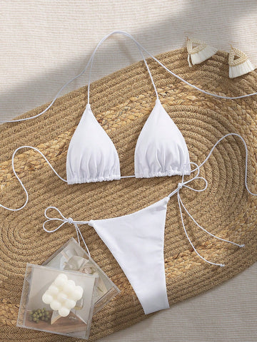 Women's 2-piece bikini set featuring a backless halter triangle top and tie-side ultra low waist bottoms.