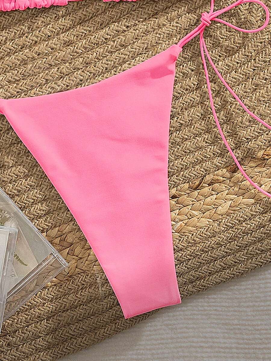 Women's 2-piece bikini set featuring a backless halter triangle top and tie-side ultra low waist bottoms.