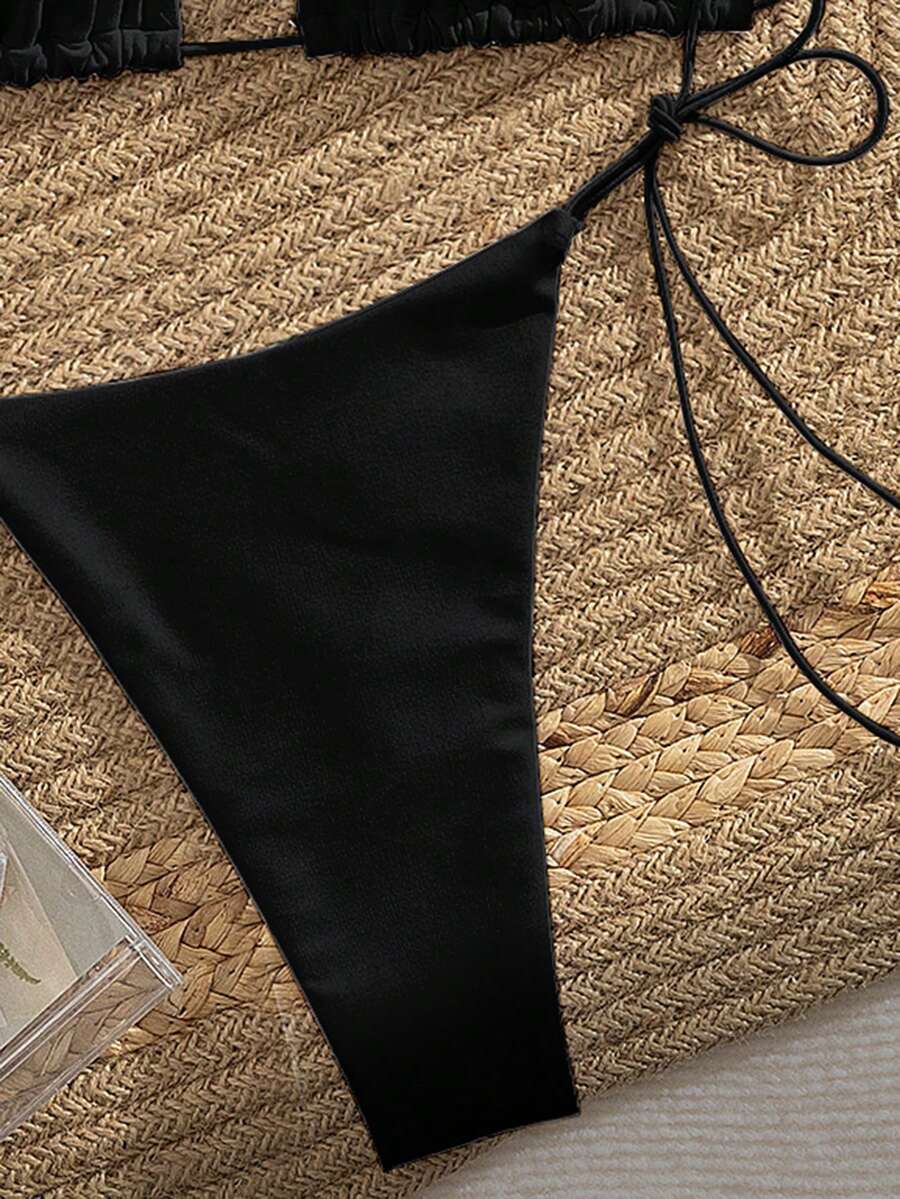 Women's 2-piece bikini set featuring a backless halter triangle top and tie-side ultra low waist bottoms.