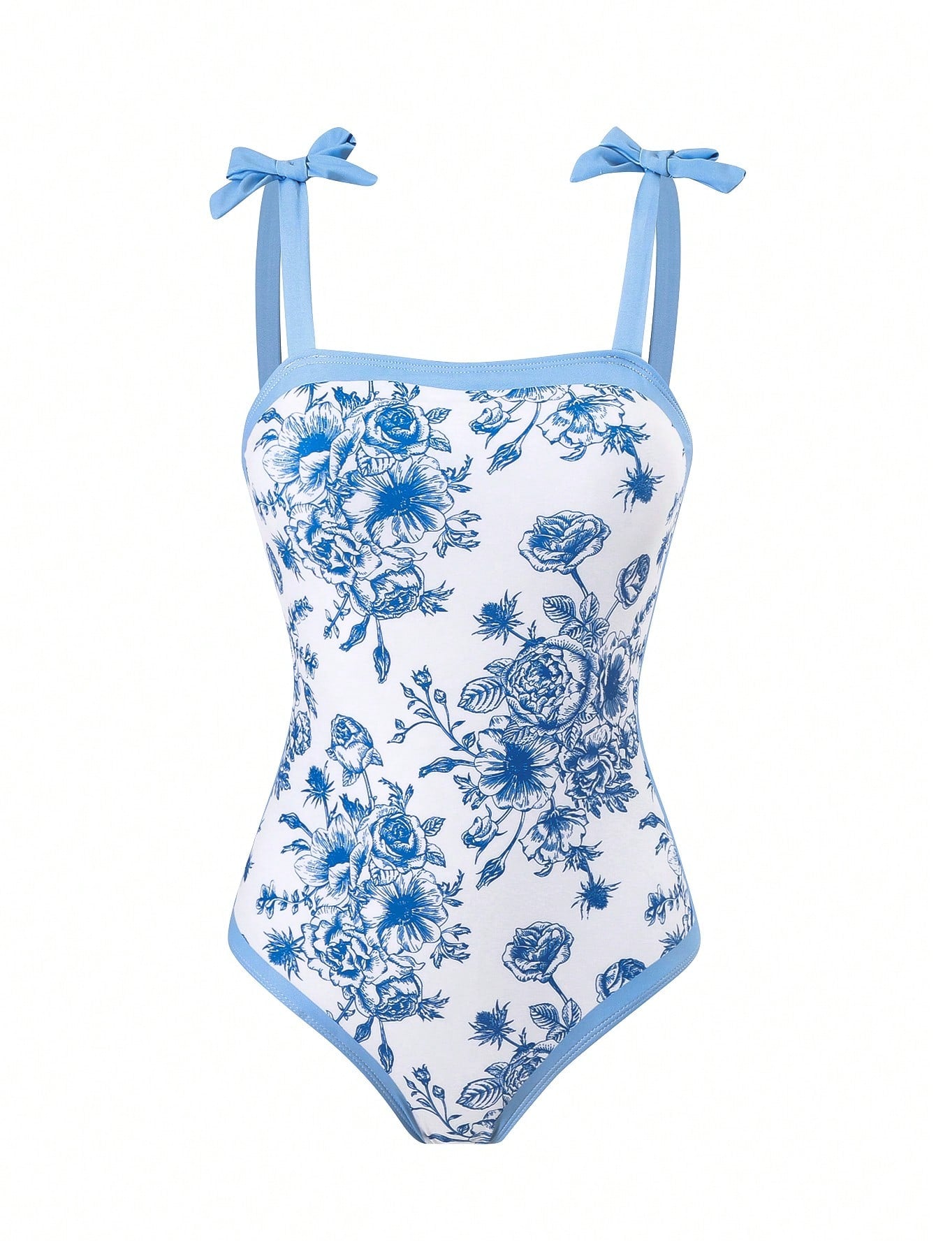 Tween girl black floral one-piece swimsuit set with spaghetti straps, asymmetrical detail, bow decor, and mid-waist bottom for beach, pool, and summer vacation wear.