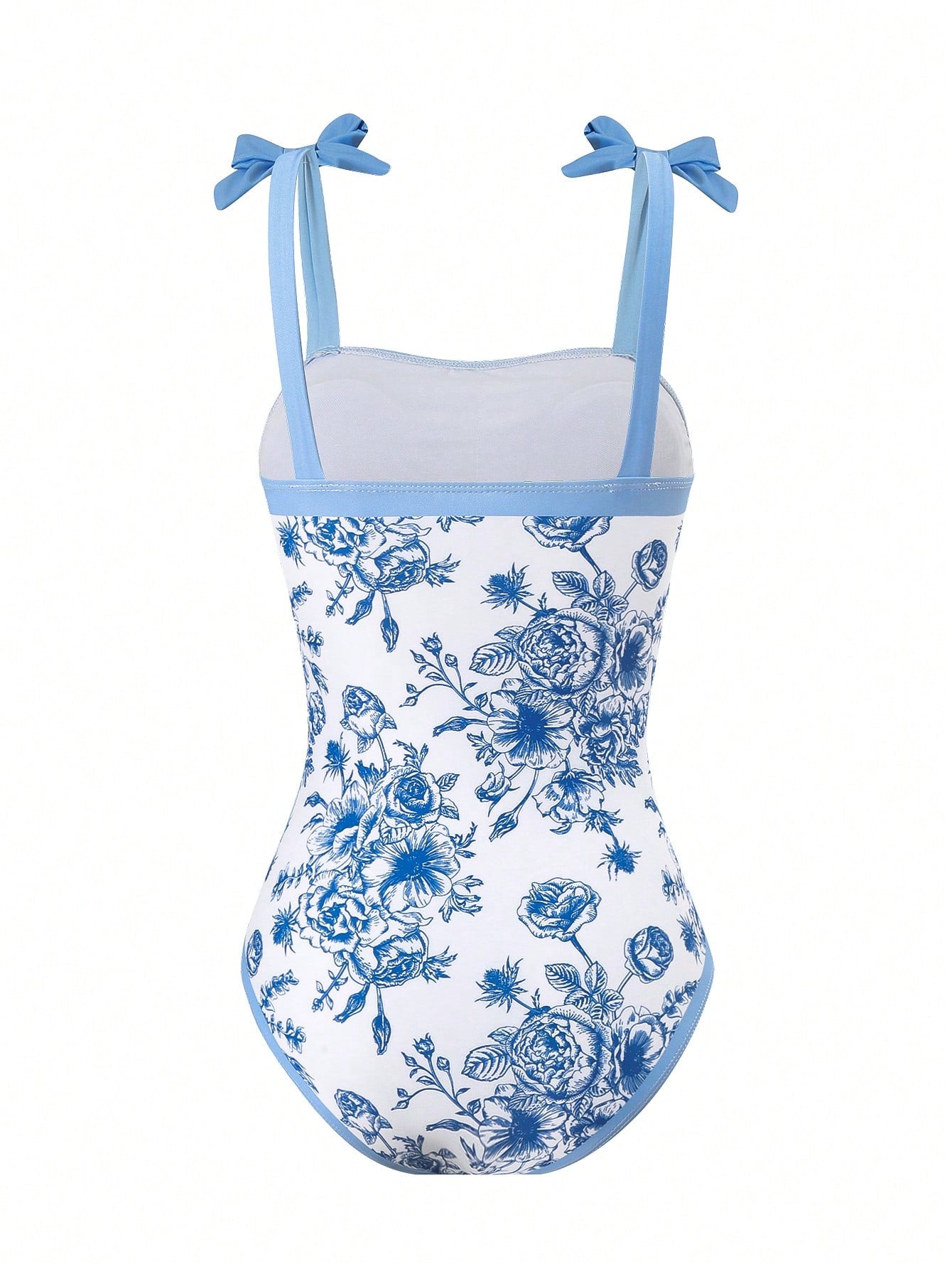 Tween girl black floral one-piece swimsuit set with spaghetti straps, asymmetrical detail, bow decor, and mid-waist bottom for beach, pool, and summer vacation wear.