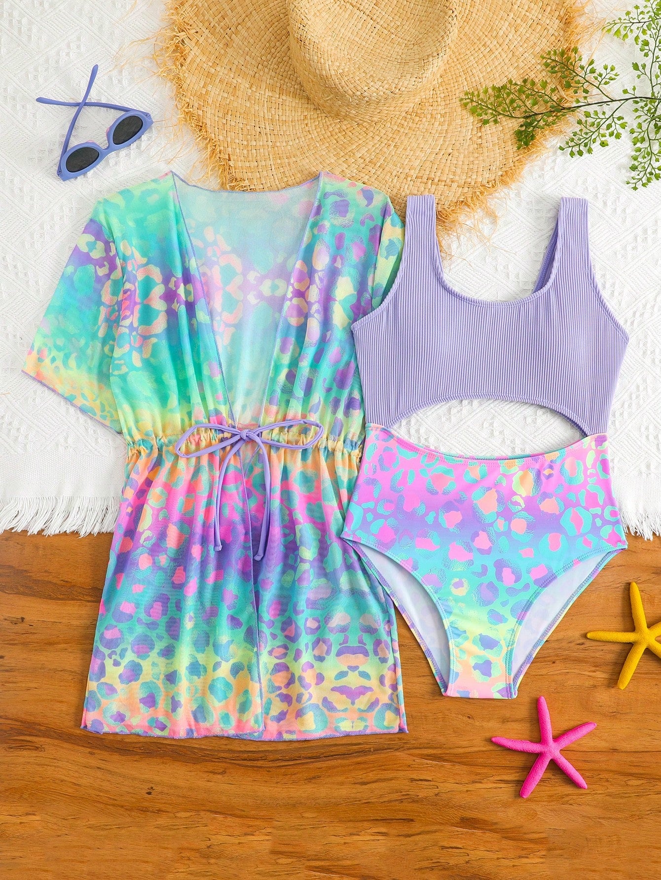 Tween girls multicolor 2-piece swimsuit set with scoop neck, cut-out details, patterned design, shorts-style bottoms, and sheer UV protection cover-up for beach and pool vacations.