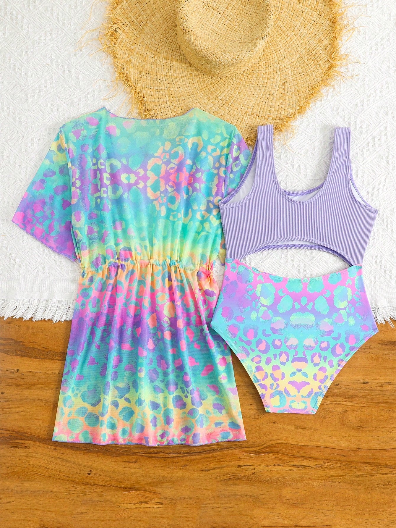 Tween girls multicolor 2-piece swimsuit set with scoop neck, cut-out details, patterned design, shorts-style bottoms, and sheer UV protection cover-up for beach and pool vacations.