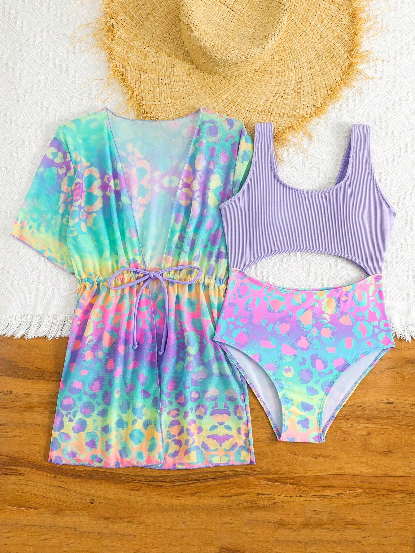 Tween girls multicolor 2-piece swimsuit set with scoop neck, cut-out details, patterned design, shorts-style bottoms, and sheer UV protection cover-up for beach and pool vacations.