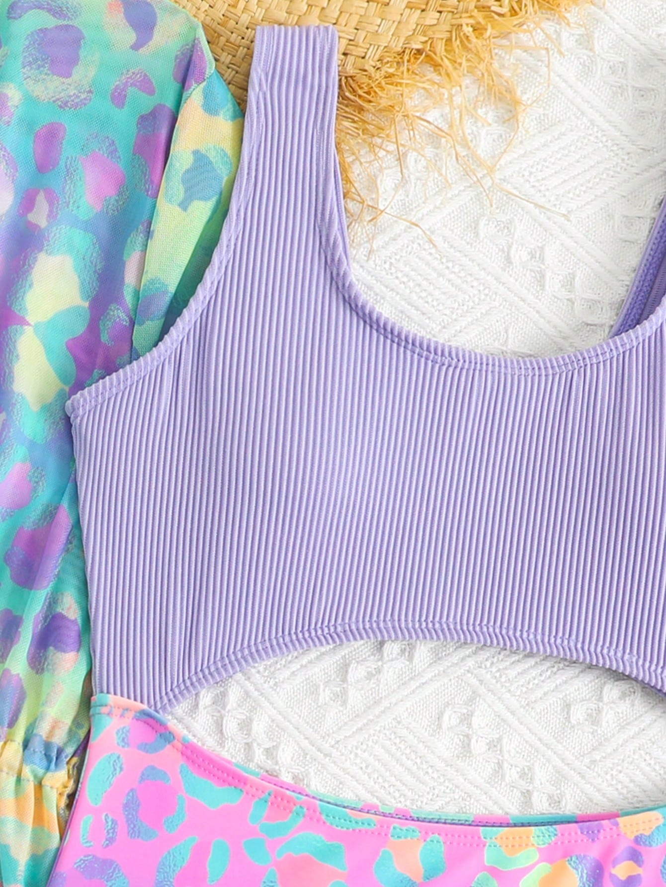 Tween girls multicolor 2-piece swimsuit set with scoop neck, cut-out details, patterned design, shorts-style bottoms, and sheer UV protection cover-up for beach and pool vacations.