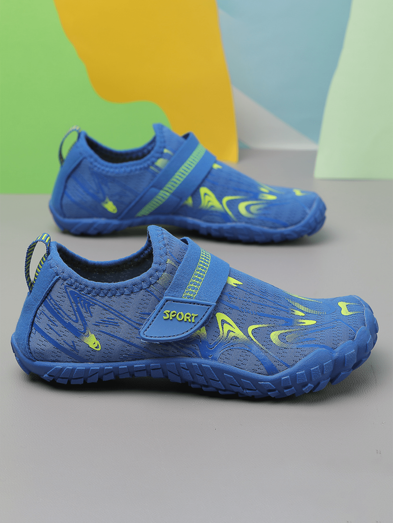 Children's water shoes featuring a breathable mesh upper, hook and loop closure, luminous details, and a non-slip outsole for boys and girls.