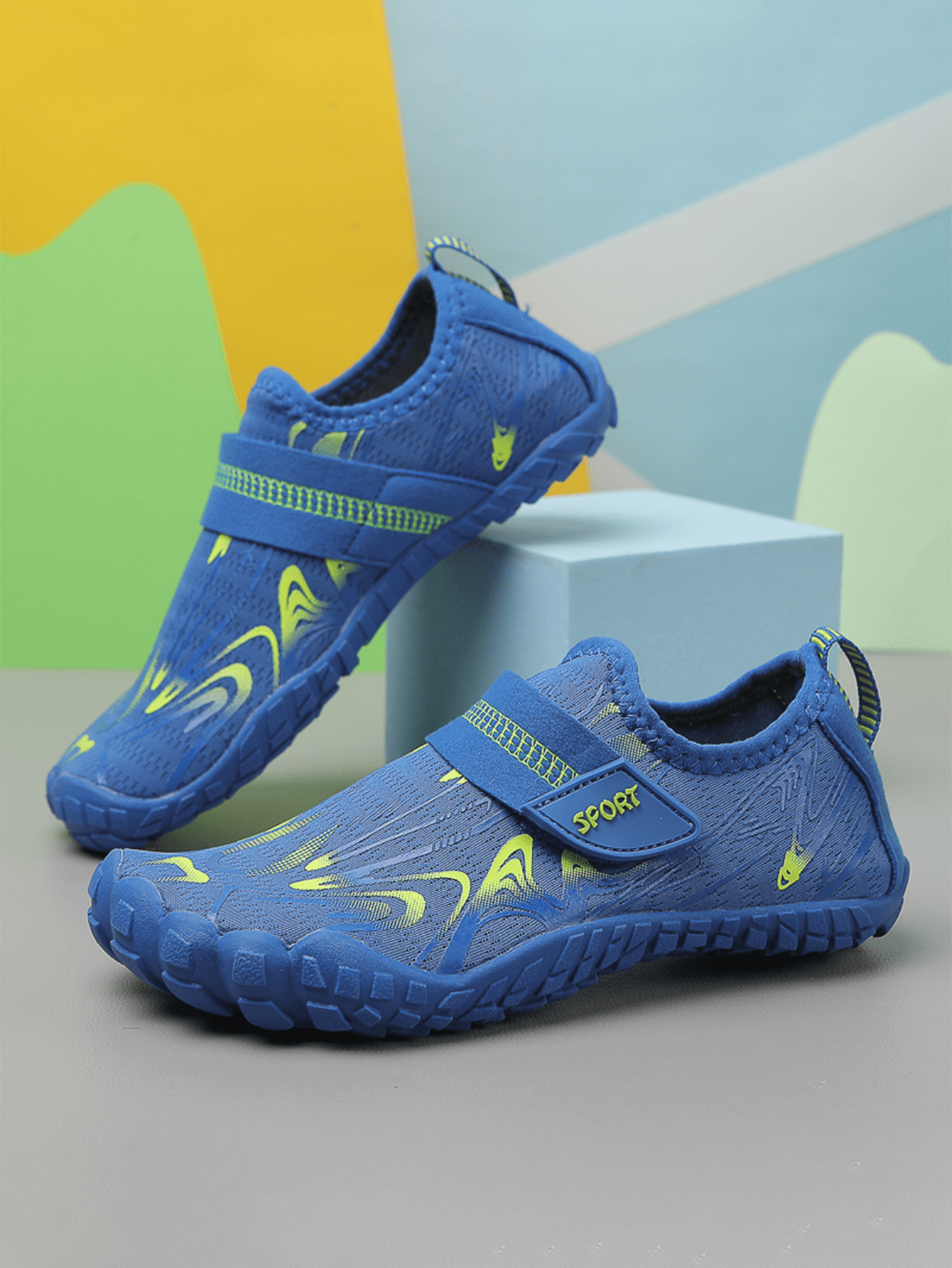 Children's water shoes featuring a breathable mesh upper, hook and loop closure, luminous details, and a non-slip outsole for boys and girls.