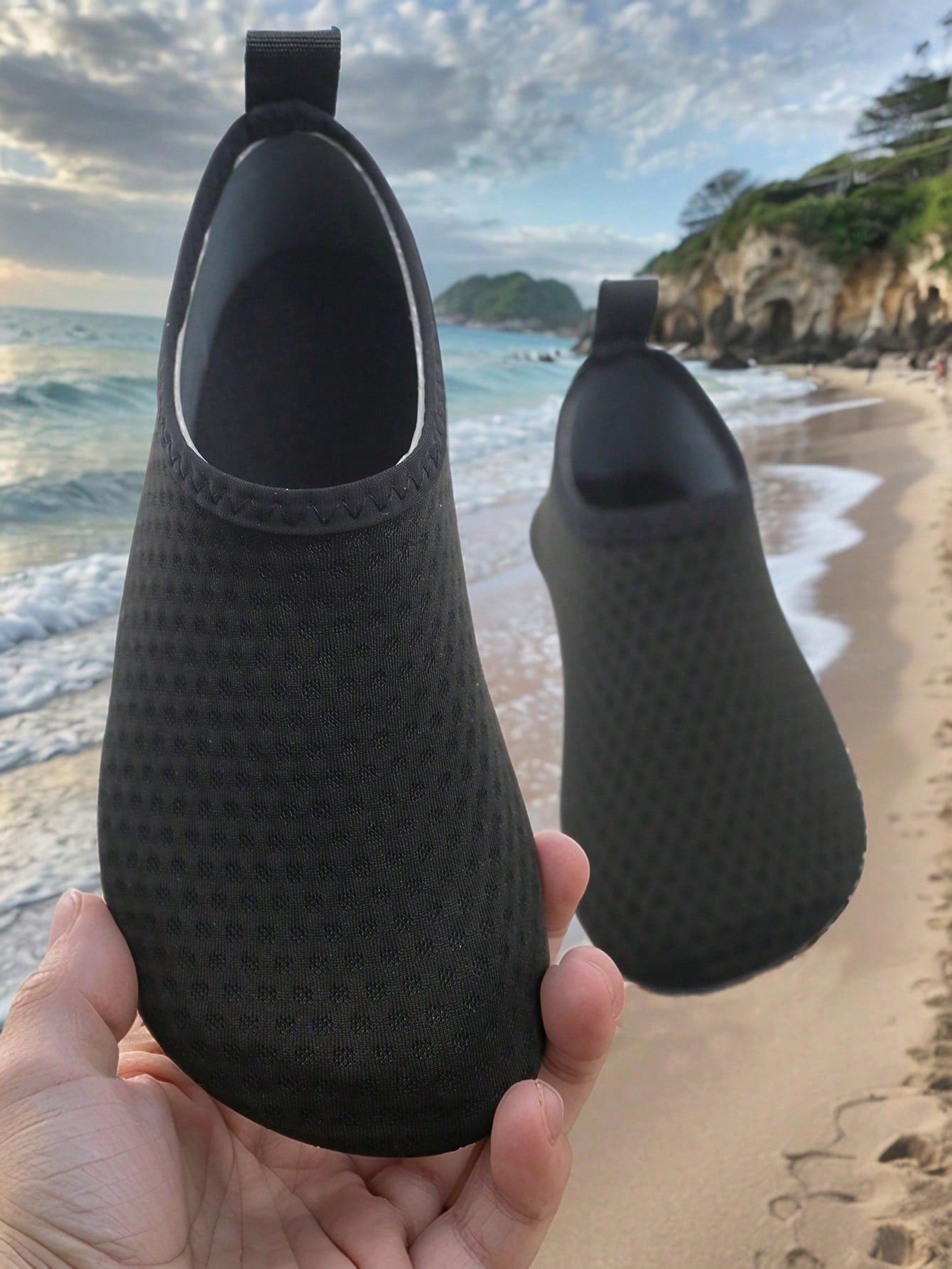 Pair of lightweight slip-on kids water shoes with breathable upper and non-slip outsole for summer beach and pool wear.