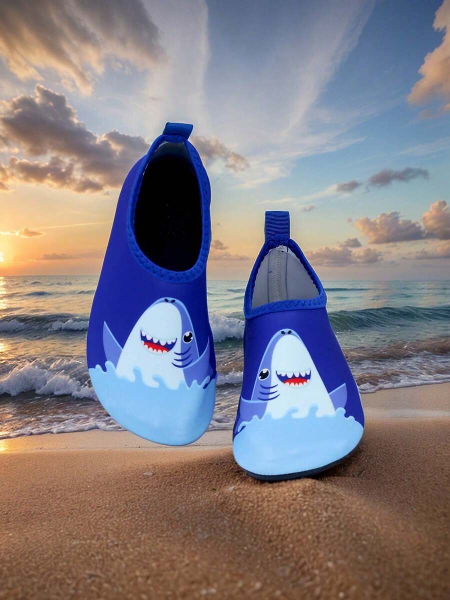Pair of lightweight slip-on kids water shoes with breathable upper and non-slip outsole for summer beach and pool wear.