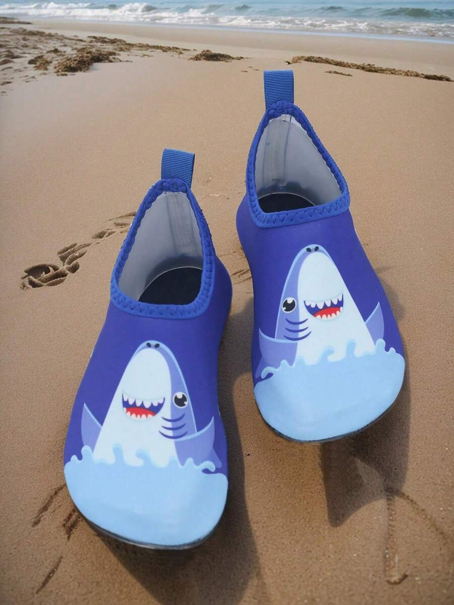 Pair of lightweight slip-on kids water shoes with breathable upper and non-slip outsole for summer beach and pool wear.