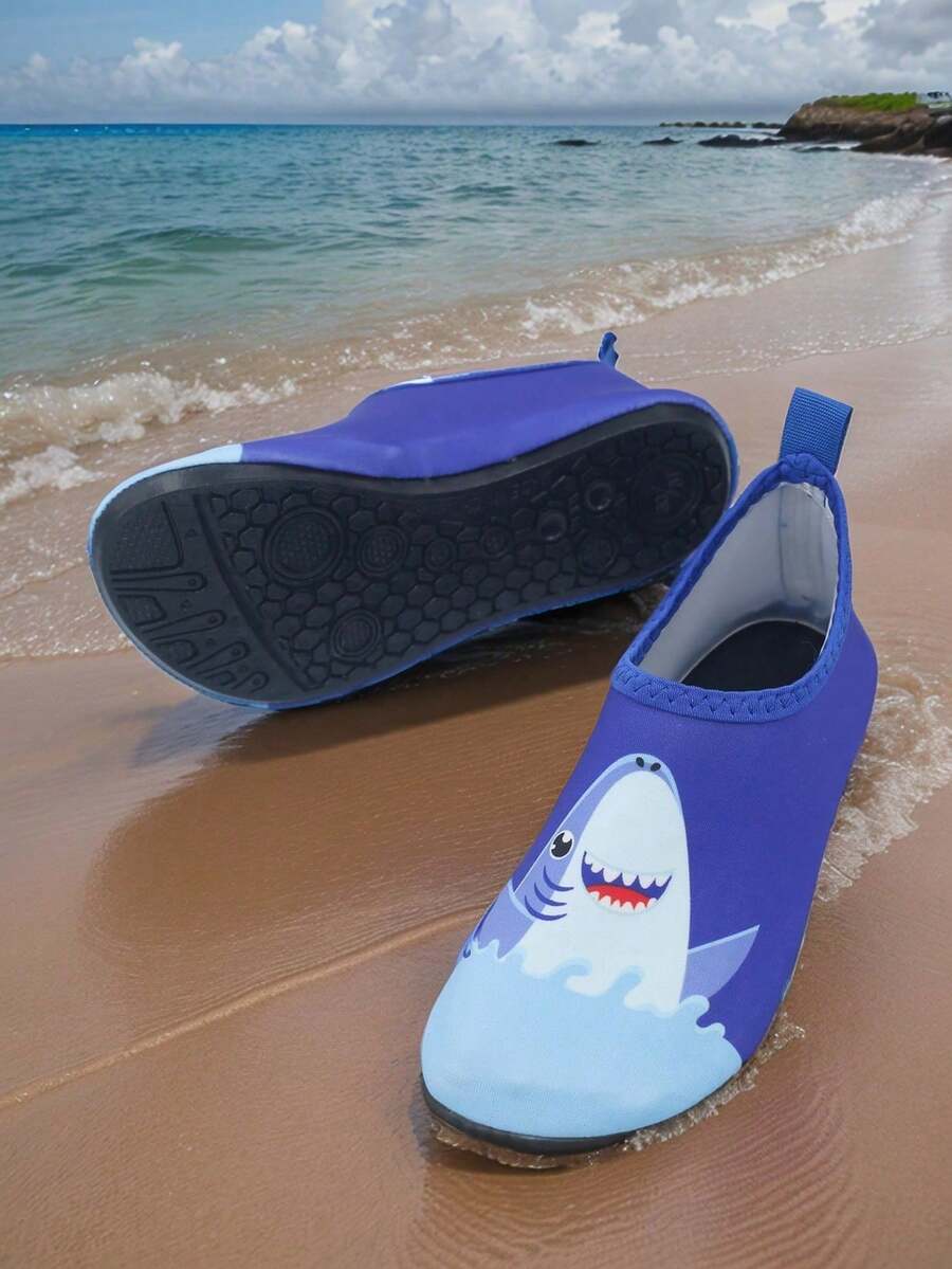 Pair of lightweight slip-on kids water shoes with breathable upper and non-slip outsole for summer beach and pool wear.